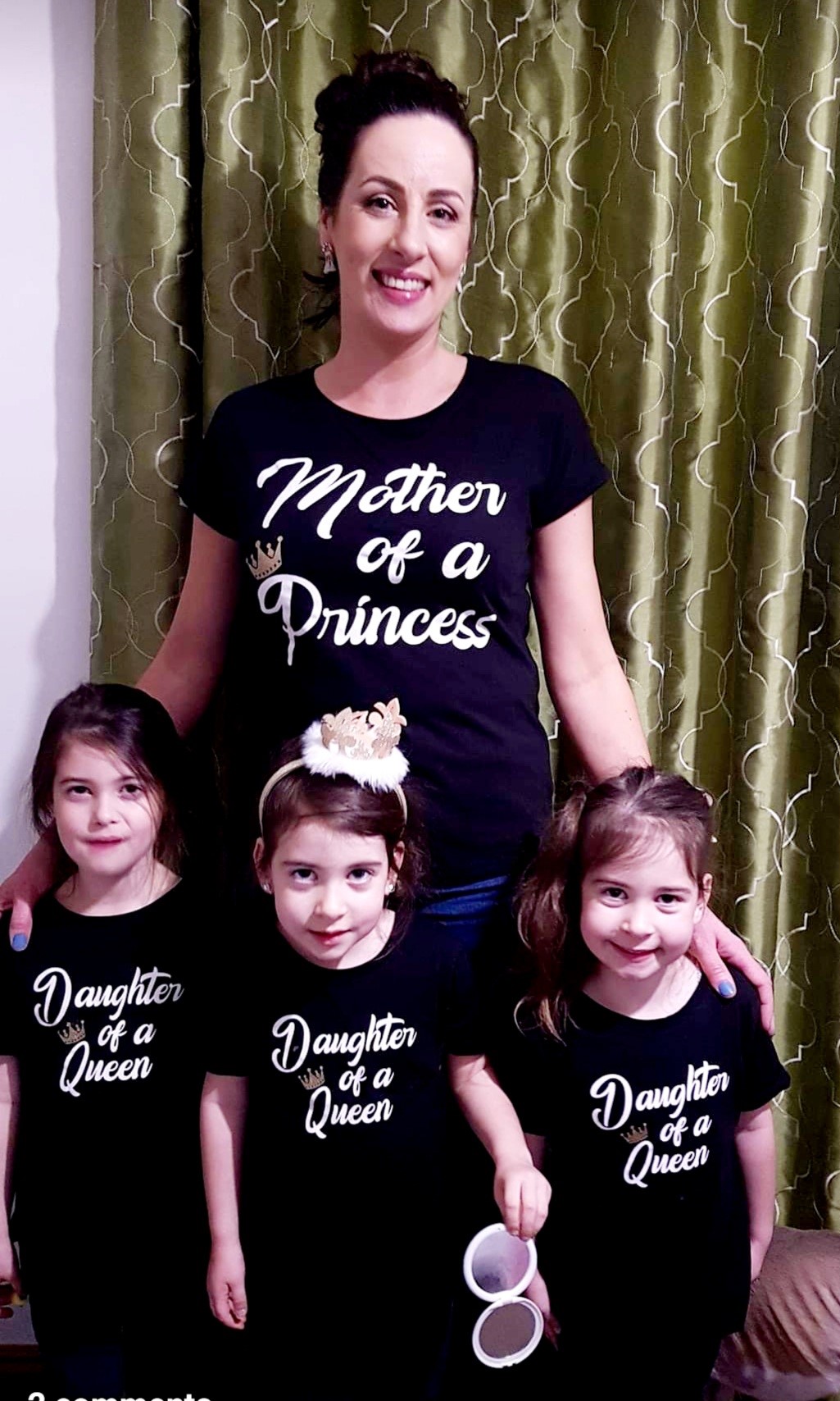 Image shows Helen standing with her three daughters.